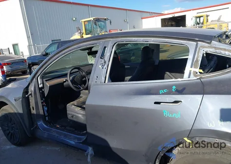 2023 Tesla Model Y Rwd from USA, damaged, VIN 7SAYGDED2PF960954